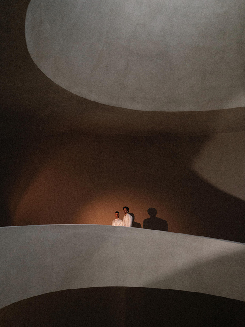 Minimal portrait of Gerry and Carlos in Portugal, blending architecture and wedding storytelling.